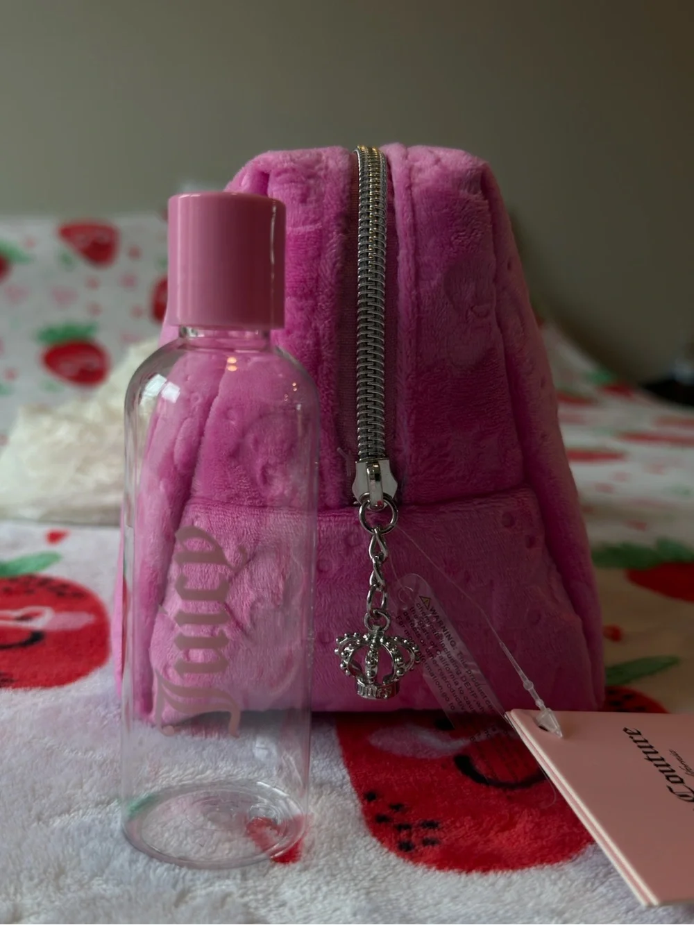 Pink Juicy Couture makeup bag with repeating 'JC' logo pattern 💖